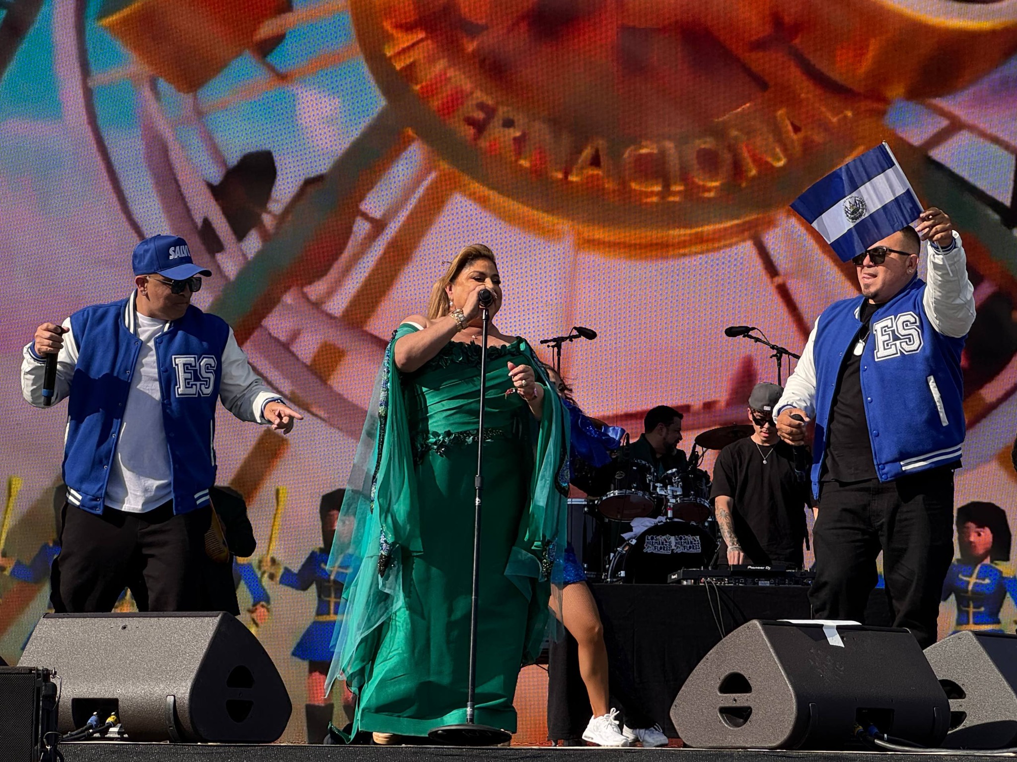 Crooked Stilo holding Salvadoran flag